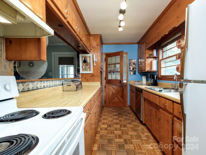 408 Pine Ridge Road, Duncan, SC 29334.  MLS# CAR4201970, YatesRealty ID 5761. Dutch door to the laundry/utility room-original parguet wood floors