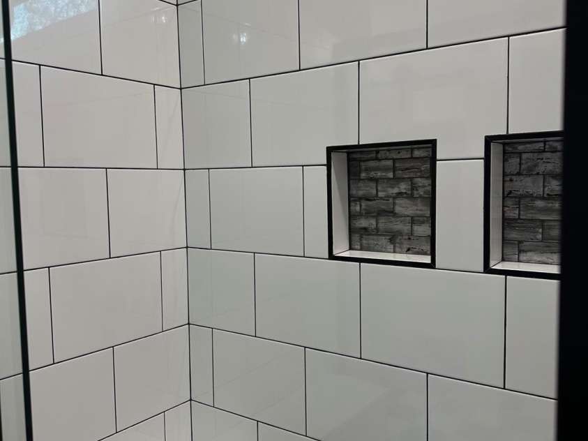 400 Martin Luther King Jr Avenue, Kannapolis, NC 28083.  MLS# CAR4225728, YatesRealty ID 5762. Bench seating with 3 product inlays. Schluter shower install.