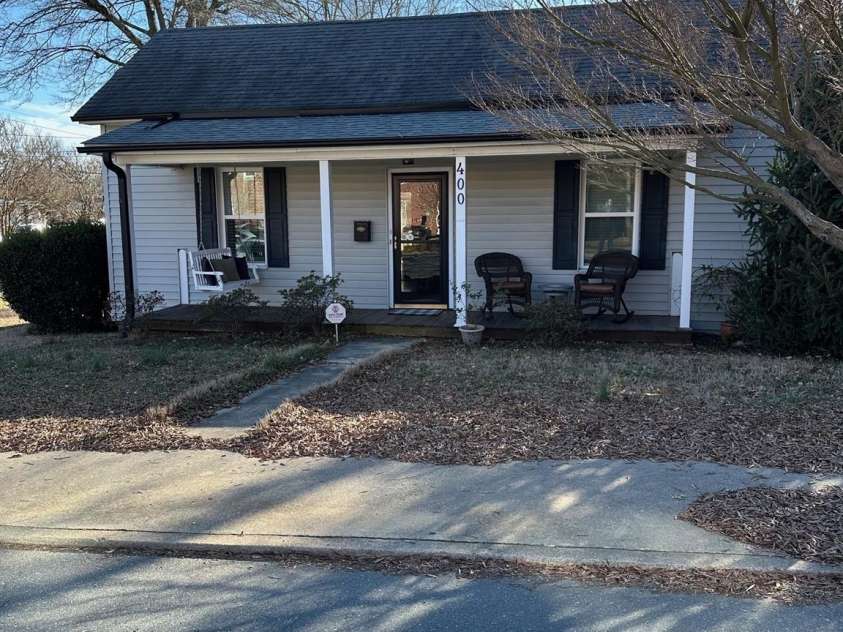 400 Martin Luther King Jr Avenue, Kannapolis, NC 28083.  MLS# CAR4225728, YatesRealty ID 5762. Rocking chair covered  front porch.