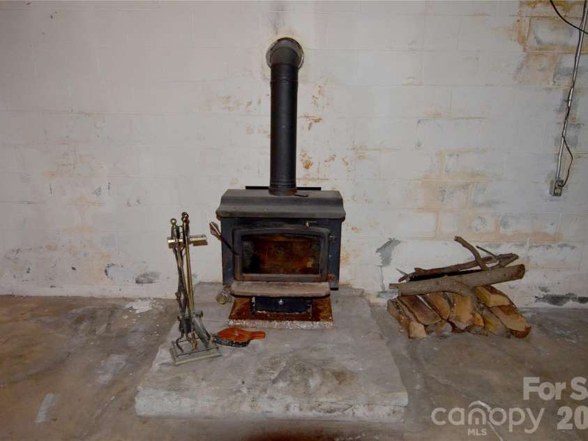 150 Eplee Loop, Marion, NC 28752.  MLS# CAR4435046, YatesRealty ID 57638. Wood stove