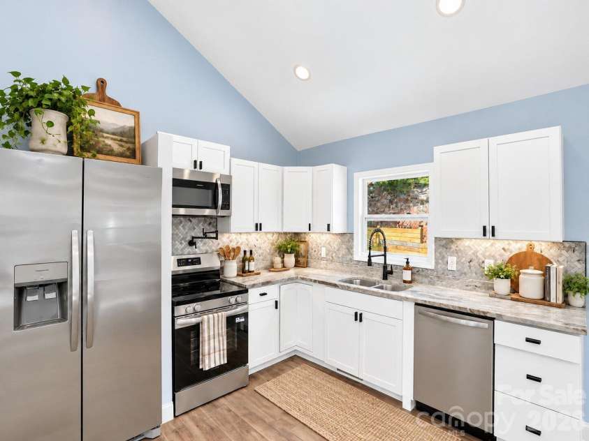 594 McMillan Drive, Hendersonville, NC 28792.  MLS# CAR4435926, YatesRealty ID 57648. Virtually Staged
