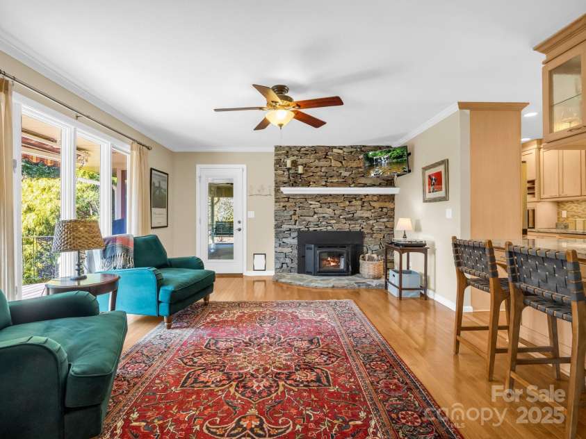 120 Yardley Court, Hendersonville, NC 28739.  MLS# CAR4226495, YatesRealty ID 5766. FAMILY ROOM  WITH WOOD BURNING STOVE ACCESS TO SCREENED IN PORCH