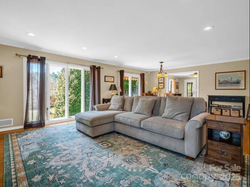 120 Yardley Court, Hendersonville, NC 28739.  MLS# CAR4226495, YatesRealty ID 5766. LIVING ROOM WITH EXPANSIVE WINDOWS