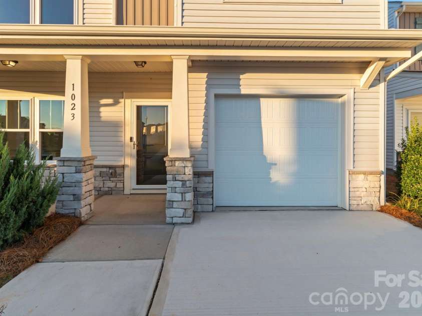 1023 Freeman View Drive, Albemarle, NC 28001.  MLS# CAR4429670, YatesRealty ID 57682. Front door with full view storm door and security camera