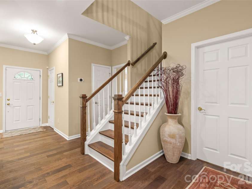 4780 Grier Farm Lane, Charlotte, NC 28270.  MLS# CAR4433351, YatesRealty ID 57760. Head upstairs to find two spacious additional bedrooms, a versatile open loft, and convenient walk-in attic space for endless, easy-access storage.
