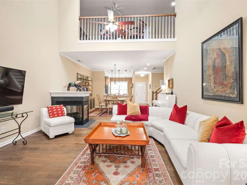 4780 Grier Farm Lane, Charlotte, NC 28270.  MLS# CAR4433351, YatesRealty ID 57760. Soaring, light-filled, and spacious! Vaulted ceilings with updated skylights elevate the main living room, while the open loft above creates a bright, architectural focal point.