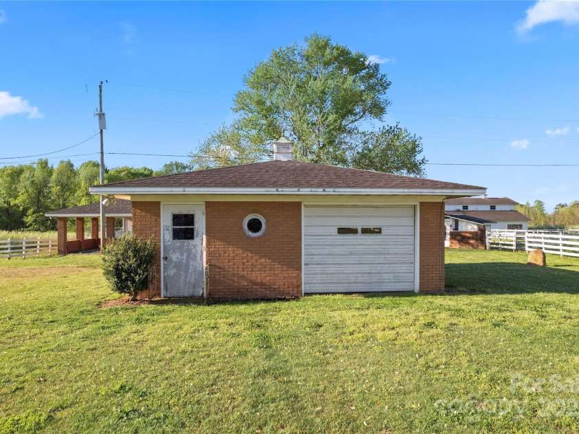 36984 B&C Carter Road, New London, NC 28127.  MLS# CAR4246178, YatesRealty ID 5777. Backyard garage