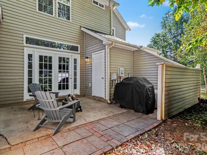 9120 Treyburn Drive, Charlotte, NC 28216.  MLS# CAR4426772, YatesRealty ID 57770. Private back patio.