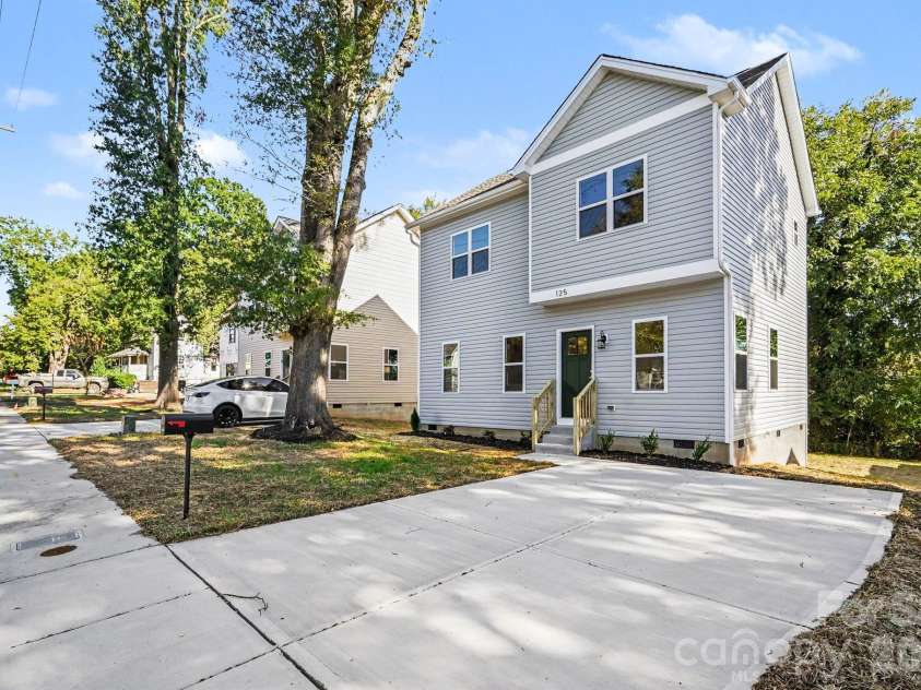 125 Buffalo Avenue, Concord, NC 28025.  MLS# CAR4436438, YatesRealty ID 57809. Concrete driveway space for 2 vehicles.