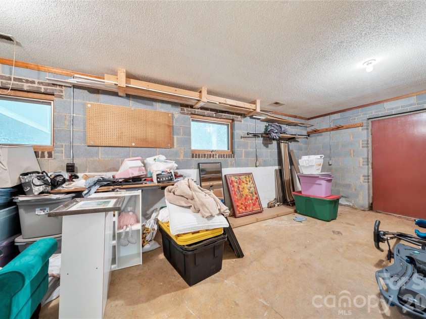 6 Oakwood Court, Clover, SC 29710.  MLS# CAR4434149, YatesRealty ID 57836. Lower level workshop with heating & cooling & direct walkout exterior access!
