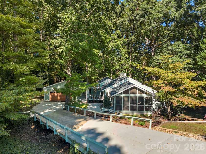 6 Oakwood Court, Clover, SC 29710.  MLS# CAR4434149, YatesRealty ID 57836. Unique private bridge has been structurally supported with Tarheel Foundation & new boards across it last year!