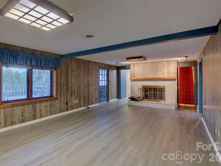 220 Grand View Lane, Burnsville, NC 28714.  MLS# CAR4354228, YatesRealty ID 5784. Lower level den