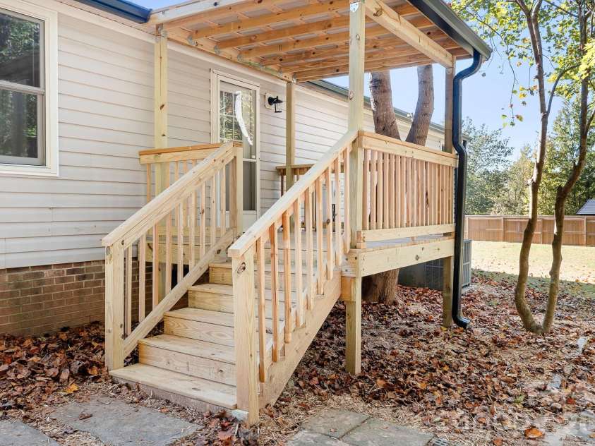 782 Monterey Drive, Iron Station, NC 28080.  MLS# CAR4436458, YatesRealty ID 57908. Back deck