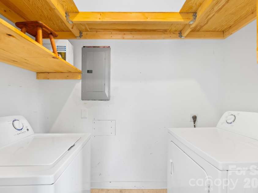 4127 Strangford Avenue, Charlotte, NC 28215.  MLS# CAR4351273, YatesRealty ID 5791. Laundry room includes storage to maximize organization and ease of use.