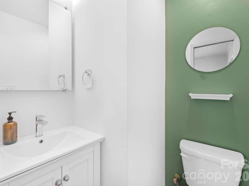 4127 Strangford Avenue, Charlotte, NC 28215.  MLS# CAR4351273, YatesRealty ID 5791. Primary suite includes a private half bath for added convenience.