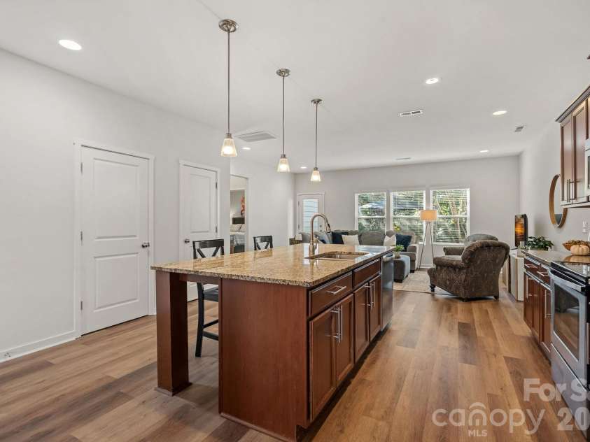 13326 Pierre Reverdy Drive, Davidson, NC 28036.  MLS# CAR4435596, YatesRealty ID 57935. Spacious Kitchen Island with pendant lighting and recessed lighting