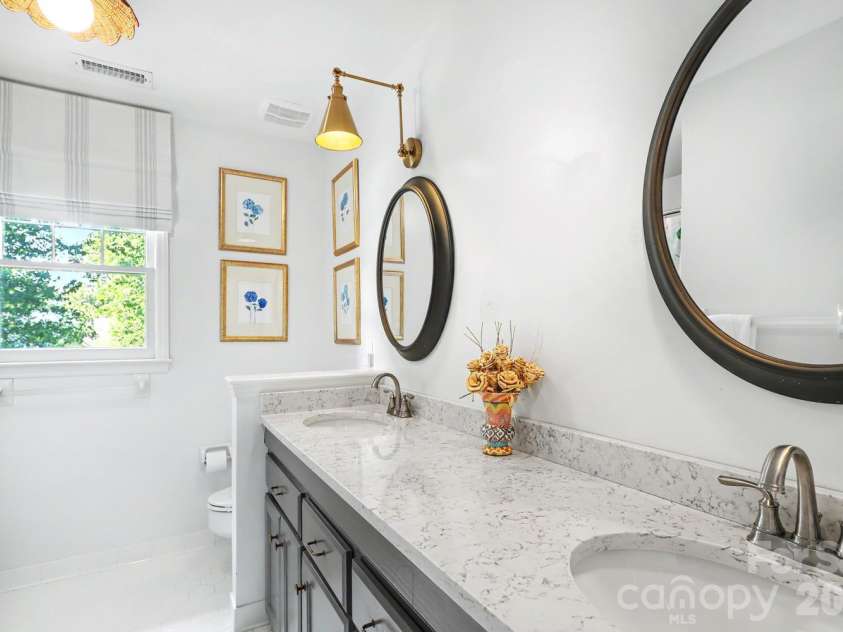 5515 McCallum Court, Charlotte, NC 28226.  MLS# CAR4435446, YatesRealty ID 57940. Hall bathroom, two sinks