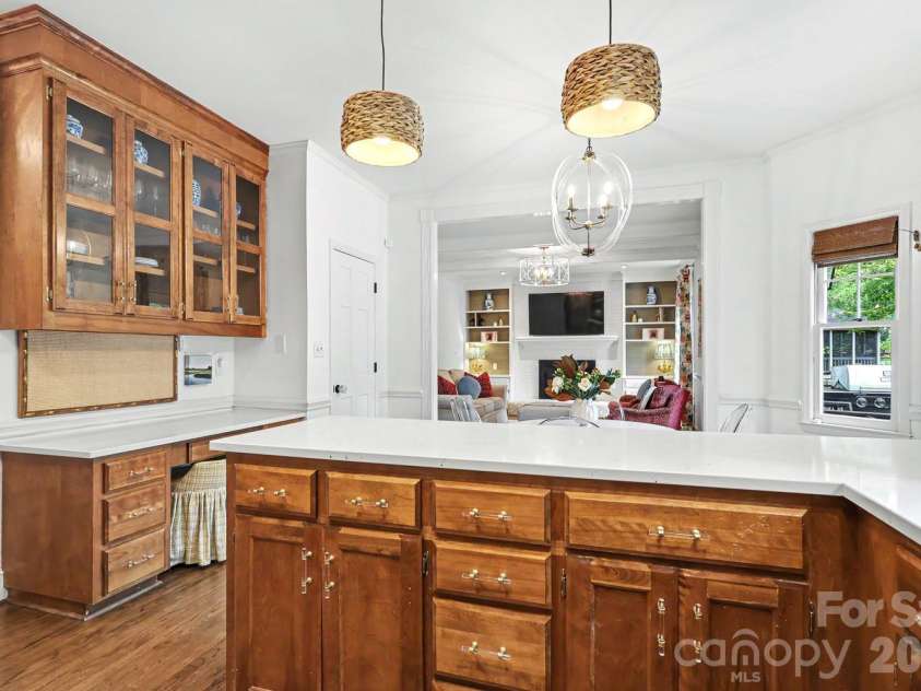5515 McCallum Court, Charlotte, NC 28226.  MLS# CAR4435446, YatesRealty ID 57940. Kitchen desk and storage