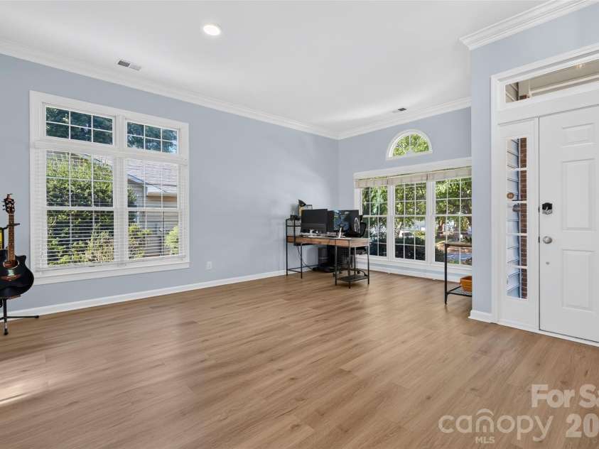 17214 Chardonnay Court, Cornelius, NC 28031.  MLS# CAR4434470, YatesRealty ID 57953. Enter into a large Living/Dining room area