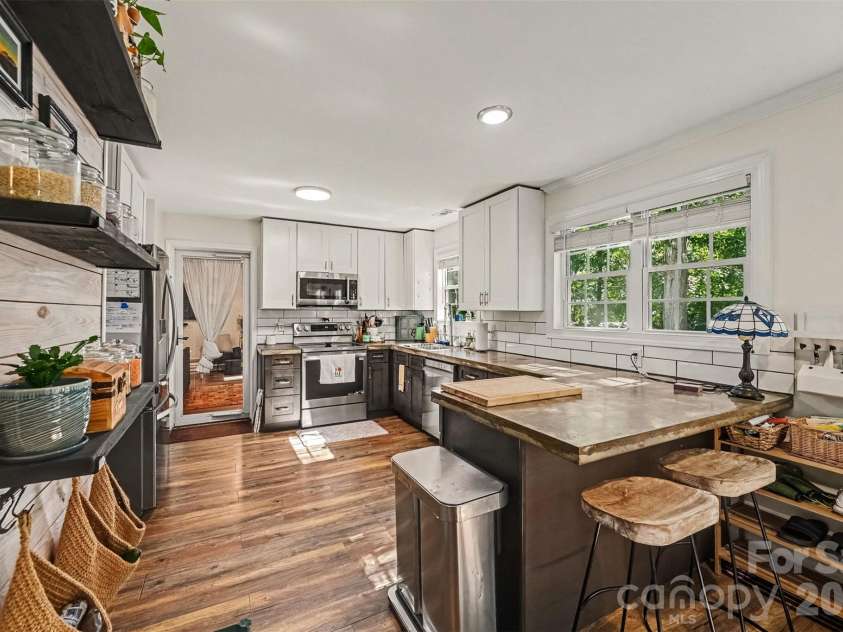 129 Shade Tree Circle, Fort Mill, SC 29715.  MLS# CAR4434473, YatesRealty ID 57954. Concrete counters, updated cabinets and appliances!