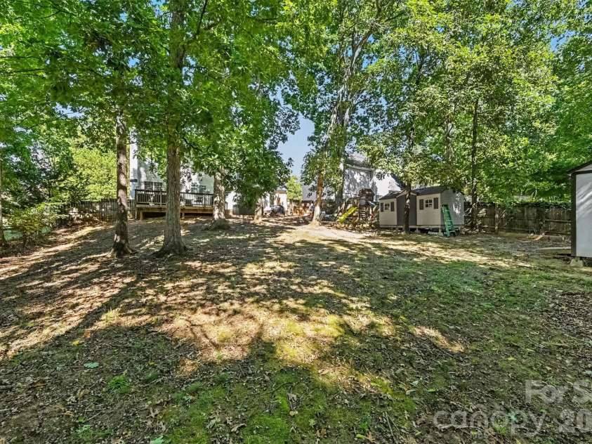 129 Shade Tree Circle, Fort Mill, SC 29715.  MLS# CAR4434473, YatesRealty ID 57954. Large backyard with shop and shade