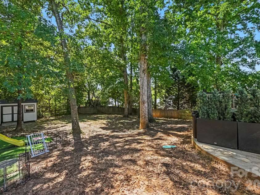 129 Shade Tree Circle, Fort Mill, SC 29715.  MLS# CAR4434473, YatesRealty ID 57954. Large backyard with shop and shade