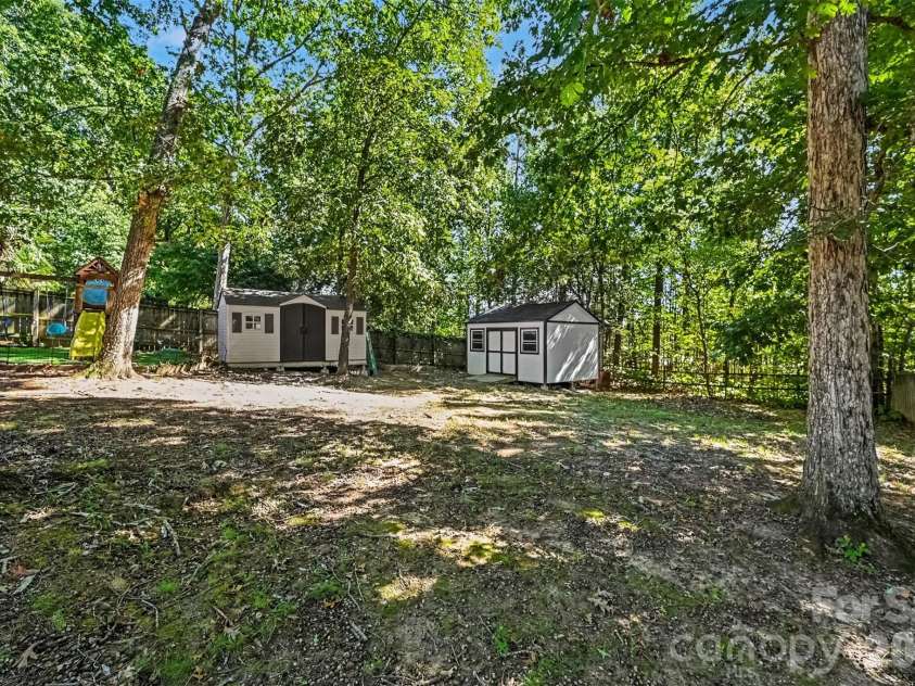 129 Shade Tree Circle, Fort Mill, SC 29715.  MLS# CAR4434473, YatesRealty ID 57954. Large backyard with shop and shade