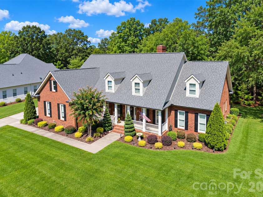 5480 Glen Forest Drive, Charlotte, NC 28226.  MLS# CAR4420356, YatesRealty ID 57976. Expansive flat lot with great shady trees. Profesional Designed Landscaping with Irrigaton System in place (2020). Two gorgeous Spiral Cedar trees, lenten roses, kaleidoscope, midget french plant and a hydrangea awa