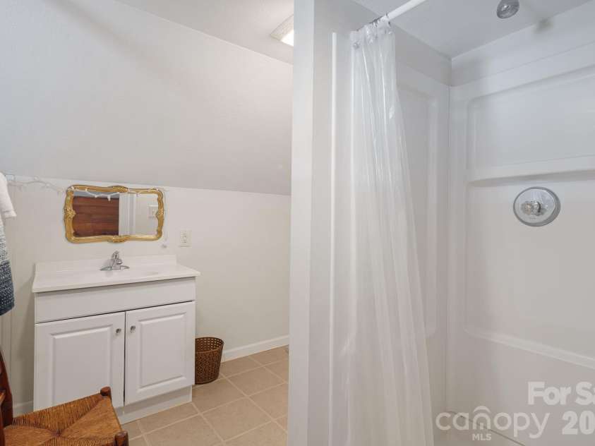 39 Brown Cove Road, Clyde, NC 28721.  MLS# CAR4433477, YatesRealty ID 57984. Second floor bathroom
