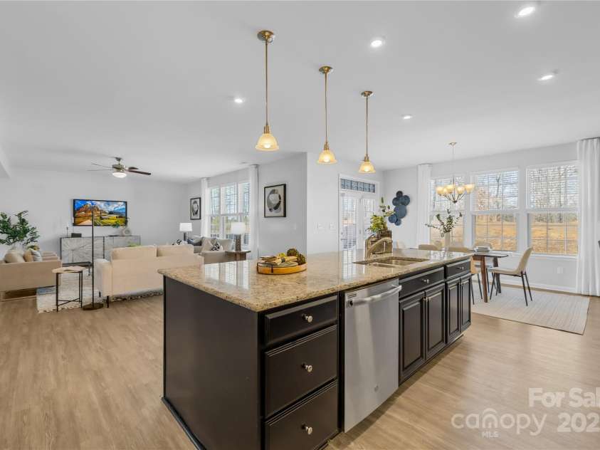 7405 Bosson Street, Concord, NC 28025.  MLS# CAR4218794, YatesRealty ID 5800. Kitchen facing living room