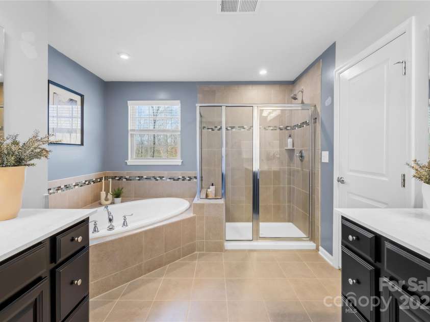 7405 Bosson Street, Concord, NC 28025.  MLS# CAR4218794, YatesRealty ID 5800. Primary bathroom tub and shower