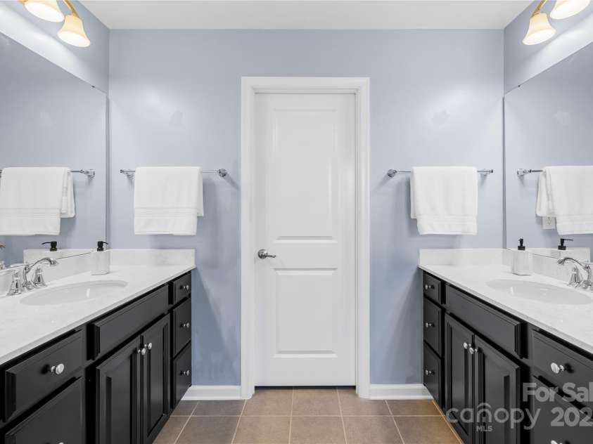 7405 Bosson Street, Concord, NC 28025.  MLS# CAR4218794, YatesRealty ID 5800. Primary bathroom vanity