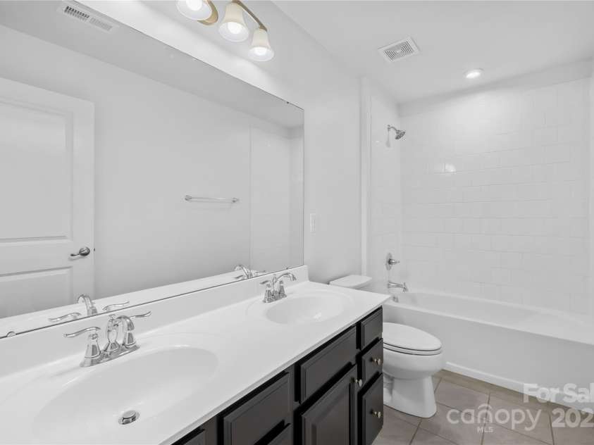 7405 Bosson Street, Concord, NC 28025.  MLS# CAR4218794, YatesRealty ID 5800. Upstairs bathroom