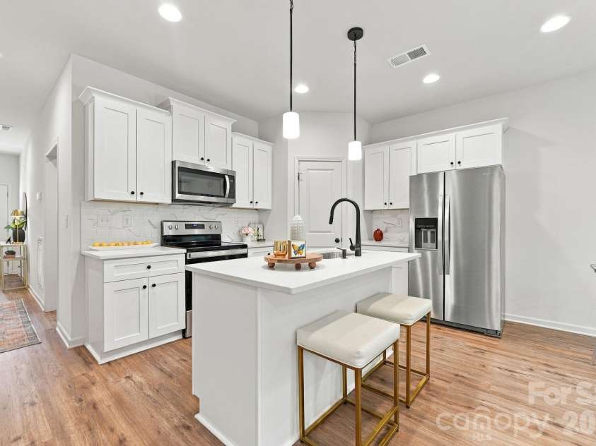 4715 Crestmont Drive, Charlotte, NC 28205.  MLS# CAR4436619, YatesRealty ID 58001. Kitchen island with seating
