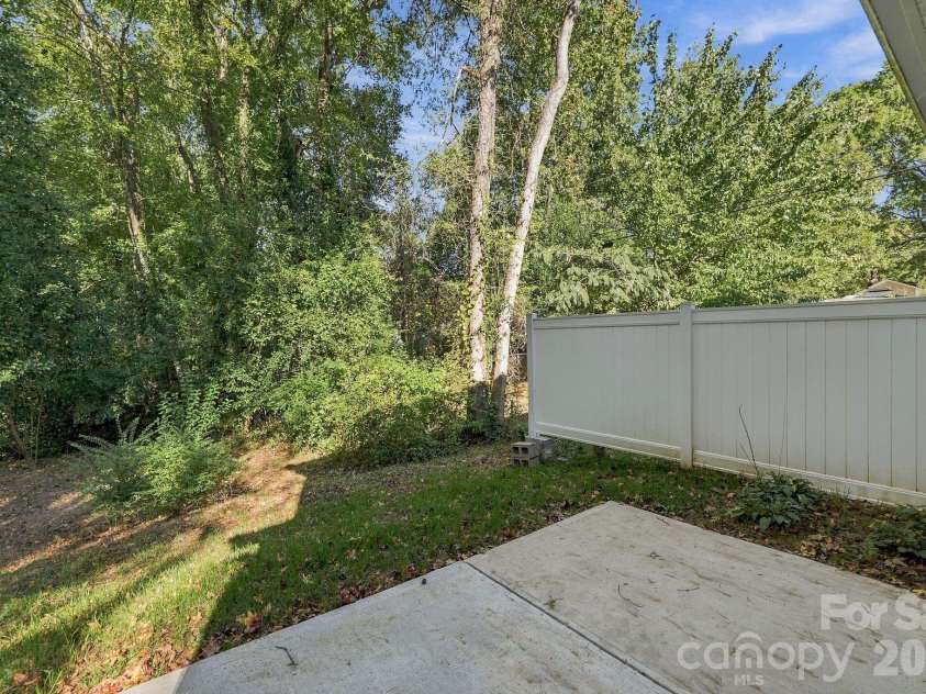 4715 Crestmont Drive, Charlotte, NC 28205.  MLS# CAR4436619, YatesRealty ID 58001. Privacy fence between the duets