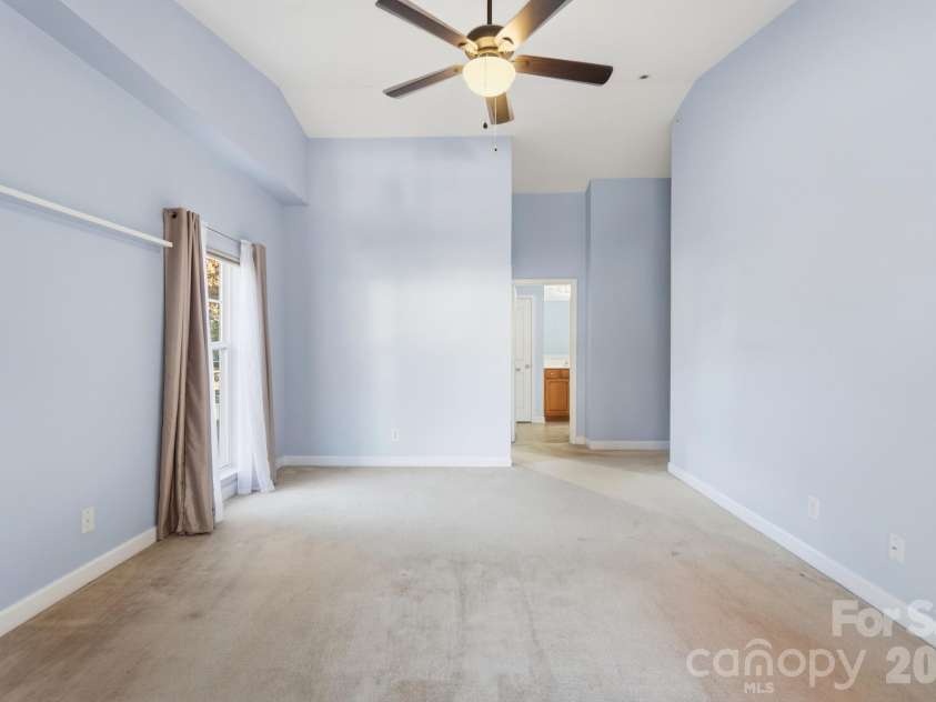 16752 Amberside Road, Cornelius, NC 28031.  MLS# CAR4435961, YatesRealty ID 58002. Primary Bedroom w/ Vaulted Ceiling