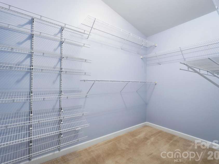 16752 Amberside Road, Cornelius, NC 28031.  MLS# CAR4435961, YatesRealty ID 58002. Primary Bedroom Walk-in Closet