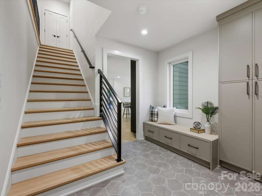 5401 Lancelot Drive, Charlotte, NC 28270.  MLS# CAR4432070, YatesRealty ID 58021. Staircase and mudroom with drop zone