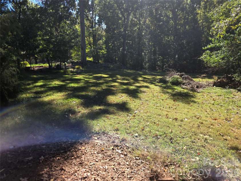 4449 Whispering Oaks Drive, Charlotte, NC 28213.  MLS# CAR4436983, YatesRealty ID 58056. Side Yard