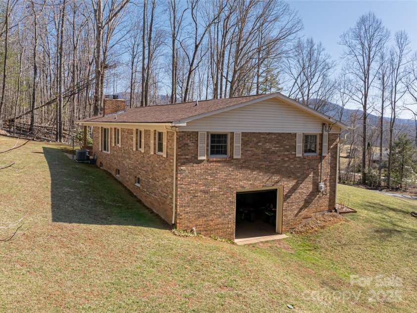 166 Huskins Road, Spruce Pine, NC 28777.  MLS# CAR4238257, YatesRealty ID 5807. Garage Door into unfinished basement.