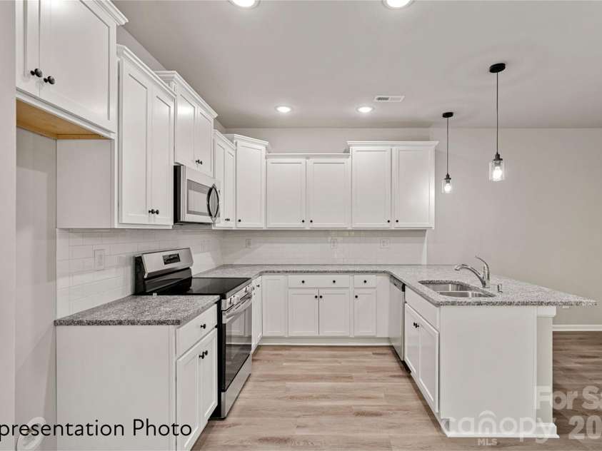 1310 Cheshire Avenue, Charlotte, NC 28208.  MLS# CAR4437125, YatesRealty ID 58070. 