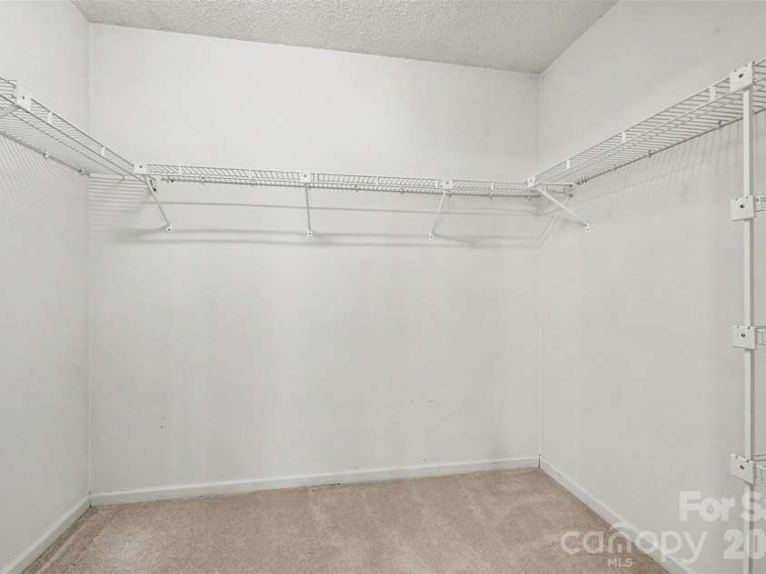 5929 Old Meadow Road, Charlotte, NC 28227.  MLS# CAR4436993, YatesRealty ID 58090. Primary Bedroom Walk-in closet