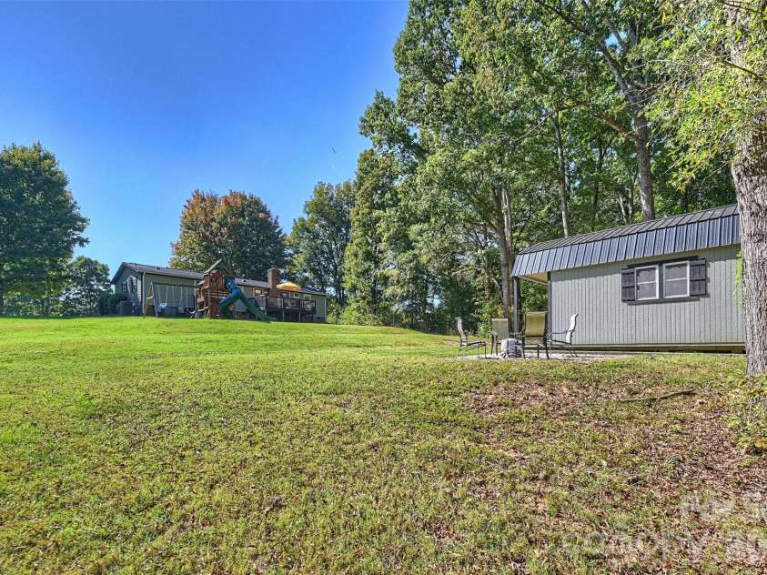 8708 Overcash Road, Concord, NC 28027.  MLS# CAR4433713, YatesRealty ID 58100. Back yard