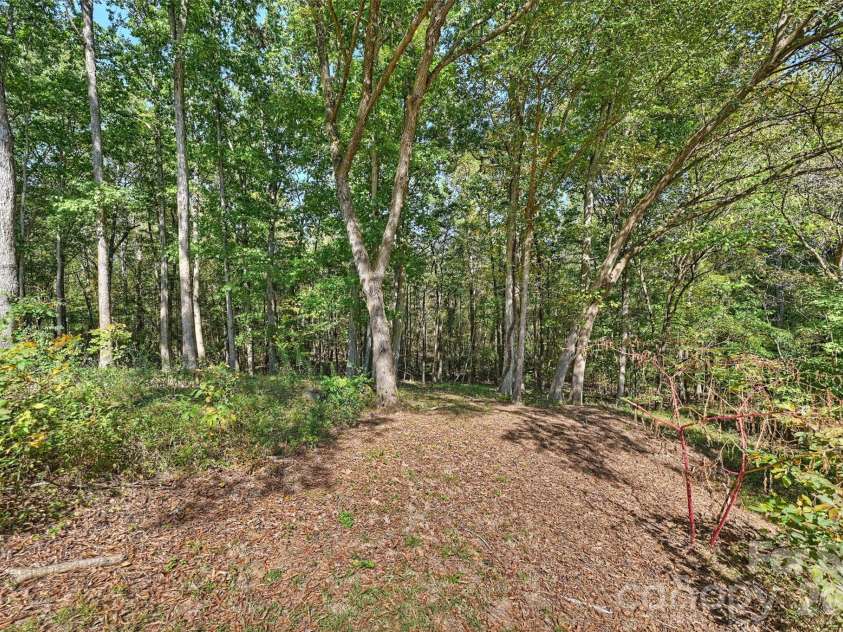 8708 Overcash Road, Concord, NC 28027.  MLS# CAR4433713, YatesRealty ID 58100. Back yard
