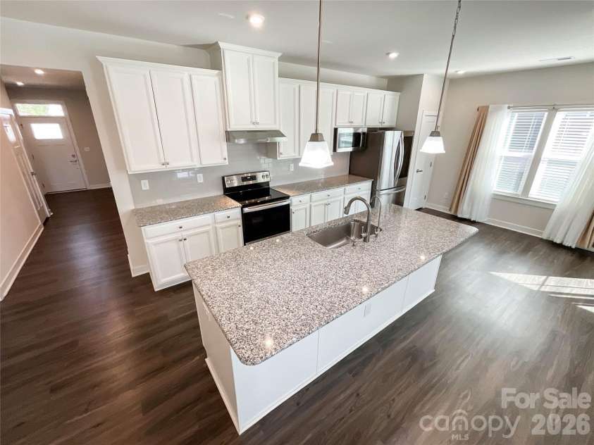 5091 Summer Surprise Lane, Charlotte, NC 28215.  MLS# CAR4437130, YatesRealty ID 58141. Kitchen and Dining Area