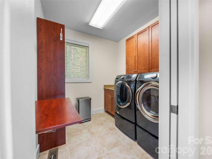 351 Chapel Road, Black Mountain, NC 28711.  MLS# CAR4435061, YatesRealty ID 58152. Main Level Laundry just off the primary bedroom.