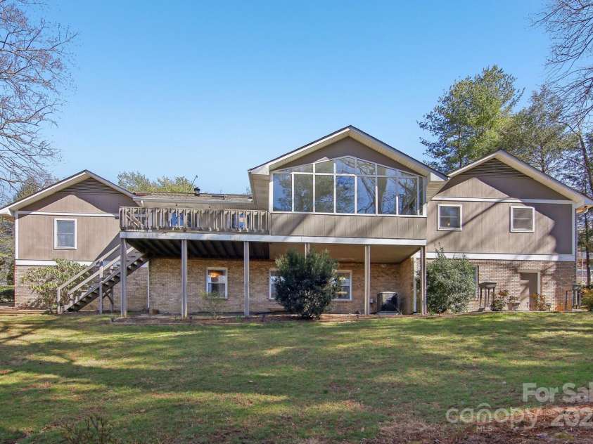 127 Kalmia Terrace Court, Hendersonville, NC 28739.  MLS# CAR4227852, YatesRealty ID 5821. Back view of home