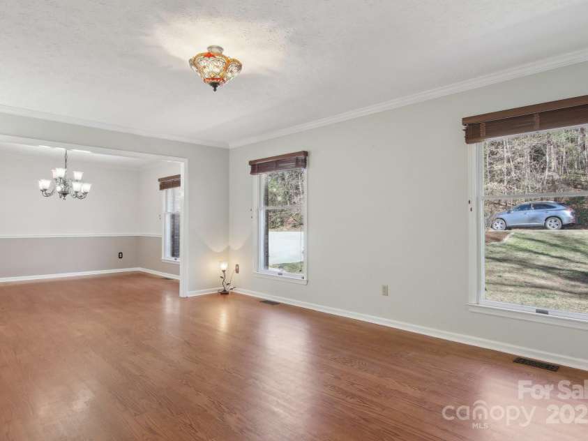 127 Kalmia Terrace Court, Hendersonville, NC 28739.  MLS# CAR4227852, YatesRealty ID 5821. Living room looking into Dining Room