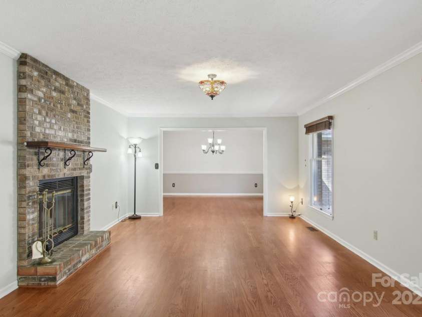 127 Kalmia Terrace Court, Hendersonville, NC 28739.  MLS# CAR4227852, YatesRealty ID 5821. Living room with wood burning fireplace