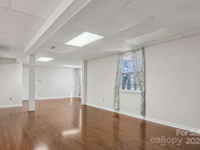 127 Kalmia Terrace Court, Hendersonville, NC 28739.  MLS# CAR4227852, YatesRealty ID 5821. Lower level family room